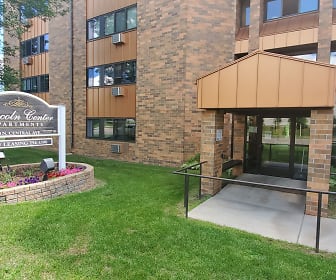view of building exterior featuring an expansive lawn, Lincoln Center Senior Apartments