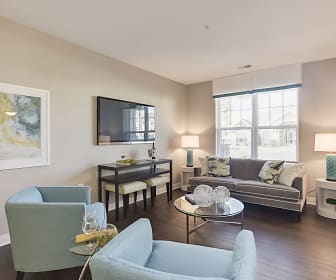 hardwood floored living room featuring natural light and TV, Avanti Luxury
