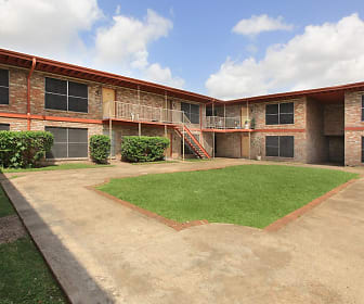 view of property with a yard, La Casita Apartments