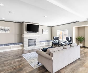 hardwood floored living room with a fireplace and TV, The Villages at Fiskville 55 + Community