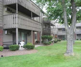 view of property featuring an expansive lawn, Turtle Creek Apartments