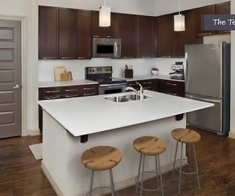 kitchen featuring stainless steel appliances, range oven, dark parquet floors, light countertops, pendant lighting, and dark brown cabinets, Camden Paces