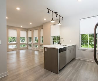kitchen featuring a wealth of natural light, refrigerator, dishwasher, light countertops, pendant lighting, light brown cabinets, and light parquet floors, 933 the U