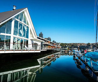 view of building exterior featuring a water view, The Cove At Tiburon