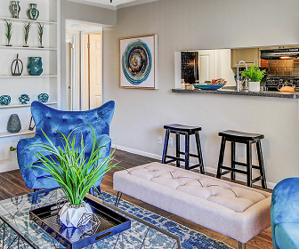 hardwood floored living room featuring a kitchen bar, Vista Del Rey Apartments