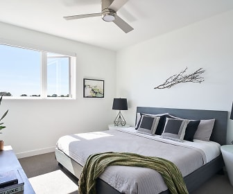 bedroom featuring a ceiling fan, carpet, and natural light, Woodside Village