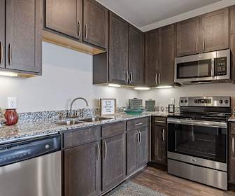 kitchen with electric range oven, stainless steel appliances, stone countertops, dark parquet floors, and dark brown cabinets, Oaks On Marketplace