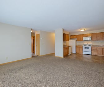 carpeted living room with refrigerator, range oven, and microwave, University Square