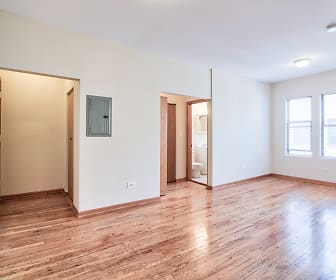empty room featuring hardwood flooring and natural light, 7100 N. Sheridan Apartments