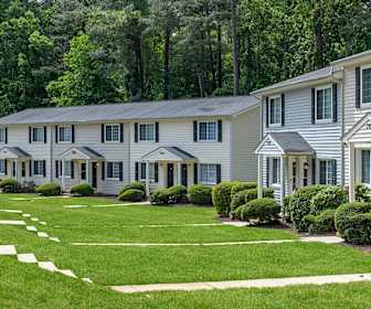 colonial-style house featuring an expansive front lawn, Tryon Village