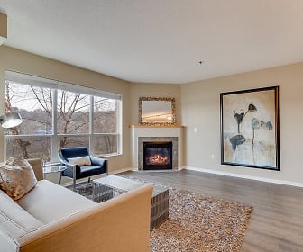 hardwood floored living room featuring a fireplace and natural light, Riverview at Upper Landing