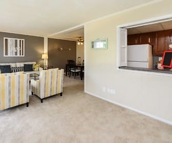 living room with carpet and refrigerator, Oxford Manor Apartments & Townhomes
