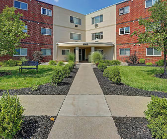 view of building exterior featuring a lawn, Norstar Apartments