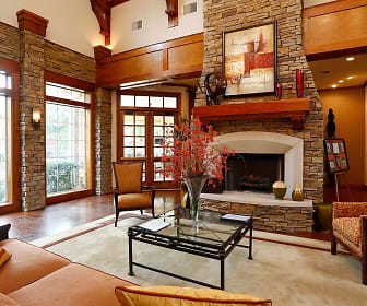 carpeted living room featuring a fireplace and plenty of natural light, The Lodge at Crossroads