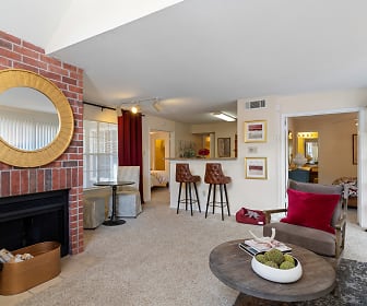 living room with a kitchen bar, a brick fireplace, and carpet, Gables Citywalk/Waterford Square