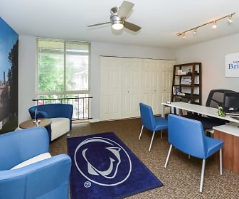 carpeted office with natural light, a ceiling fan, and TV, Briarwood Apartments & Townhomes