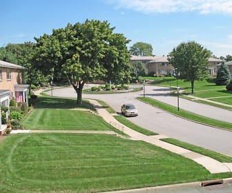 surrounding community with a large lawn and fire pit, Berdan Court