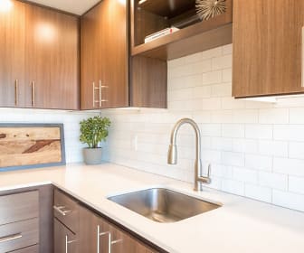 kitchen with brown cabinets and light countertops, Tabor View Lofts