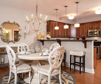 dining room with a kitchen breakfast bar, stainless steel microwave, and range oven, Vineyard Commons 55+ Senior Community