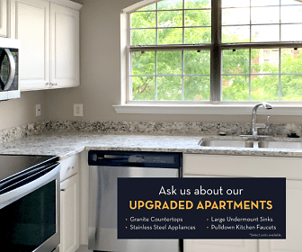 kitchen featuring a wealth of natural light, refrigerator, dishwasher, electric range oven, stainless steel microwave, white cabinets, and light granite-like countertops, Saddlebrook