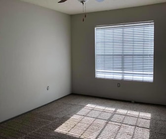 empty room featuring carpet, natural light, and a ceiling fan, Carondolet Apartments