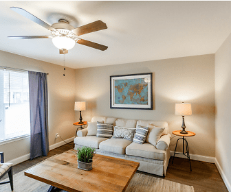 hardwood floored living room with a ceiling fan and natural light, Mill Springs Townhomes