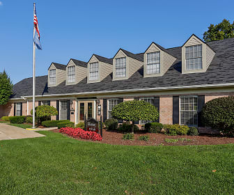 new england style home with a large front lawn, Williamsburg on The Lake Apartments of Mishawaka