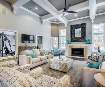 living room featuring a fireplace, a ceiling fan, a wealth of natural light, and TV, Alta Shores