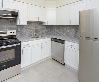 kitchen featuring stainless steel appliances, electric range oven, light tile flooring, white cabinets, and light stone countertops, Eatoncrest Apartment Homes