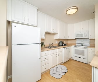 kitchen with electric range oven, refrigerator, dishwasher, microwave, light hardwood flooring, white cabinets, and light countertops, Riva Ridge