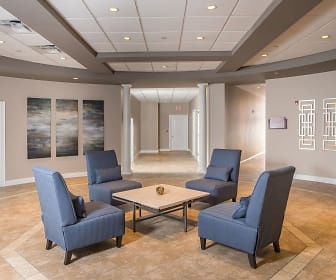 building lobby with an outdoor living space and beamed ceiling, Vineyard Commons 55+ Senior Community