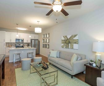 living room with a ceiling fan, hardwood flooring, refrigerator, range oven, and microwave, Silver Collection at Celebrate