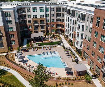 view of building exterior with a swimming pool, Trilogy Chapel Hill