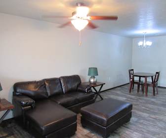 hardwood floored living room featuring a ceiling fan, Beal Townhomes