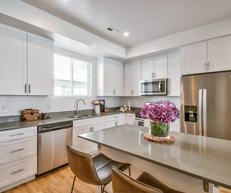 kitchen featuring natural light, stainless steel appliances, white cabinetry, and light parquet floors, Moda Spring Run