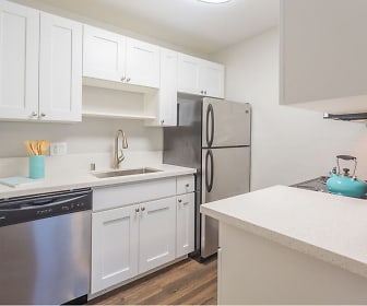 kitchen featuring refrigerator, stainless steel dishwasher, light granite-like countertops, white cabinetry, and light parquet floors, Skyline Heights