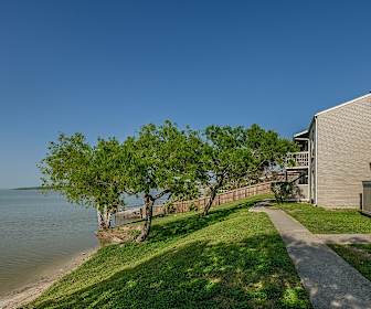 property view of water with a large lawn, The Bay Club