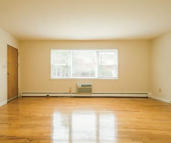 spare room with hardwood flooring, natural light, and baseboard radiator, Country Club Apartments