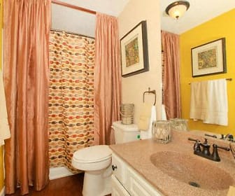 bathroom with mirror, shower curtain, toilet, and vanity, The Granite At Tuscany Hills