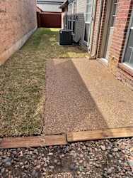 Patio and sideyard leading to small backyard
