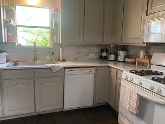 Kitchen featuring quartz countertops and a marble backsplash!