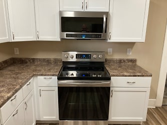 Stainless steel range/oven and large microwave