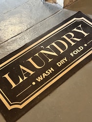 Step into our clean and spacious laundry area, where convenience meets comfort. We've thought of everything to make laundry day a breeze. From ample hangers and tables to entertainment options like TV and books, plus additional seating for your comfo