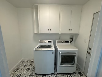 Laundry room with washer and dryer.JPG