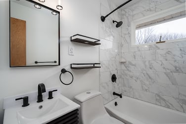 Bathroom Main Floor - completely renovated with tile and new fixtures