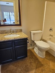 Main bath appointed with granite countertop and tile flooring!