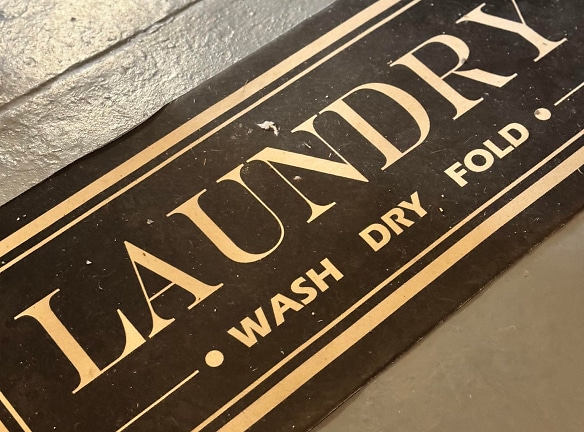 Step into our clean and spacious laundry area, where convenience meets comfort. We've thought of everything to make laundry day a breeze. From ample hangers and tables to entertainment options like TV and books, plus additional seating for your comfo